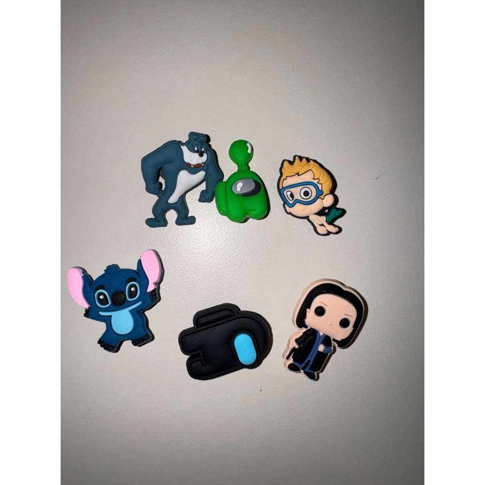 Mixed lot Jibbitz Snape, bubble guppies, among us, Disney Stitch,  Spike dog